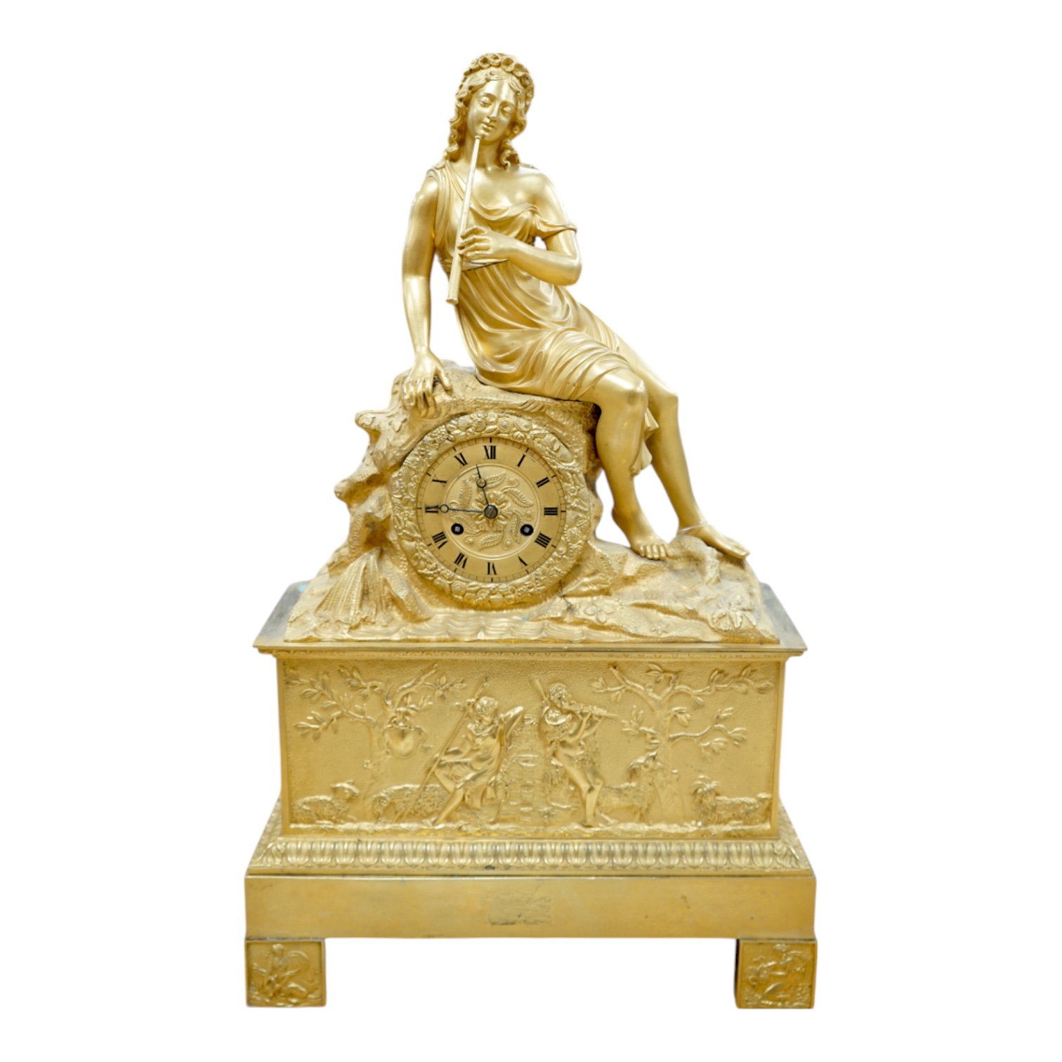 A French Louis Philippe period Empire ormolu clock, with seated classical female upon a rock enclosing the dial, the whole upon a square base with allegorical patch in relief, c.1830, with key, 57cm high. Condition - fai